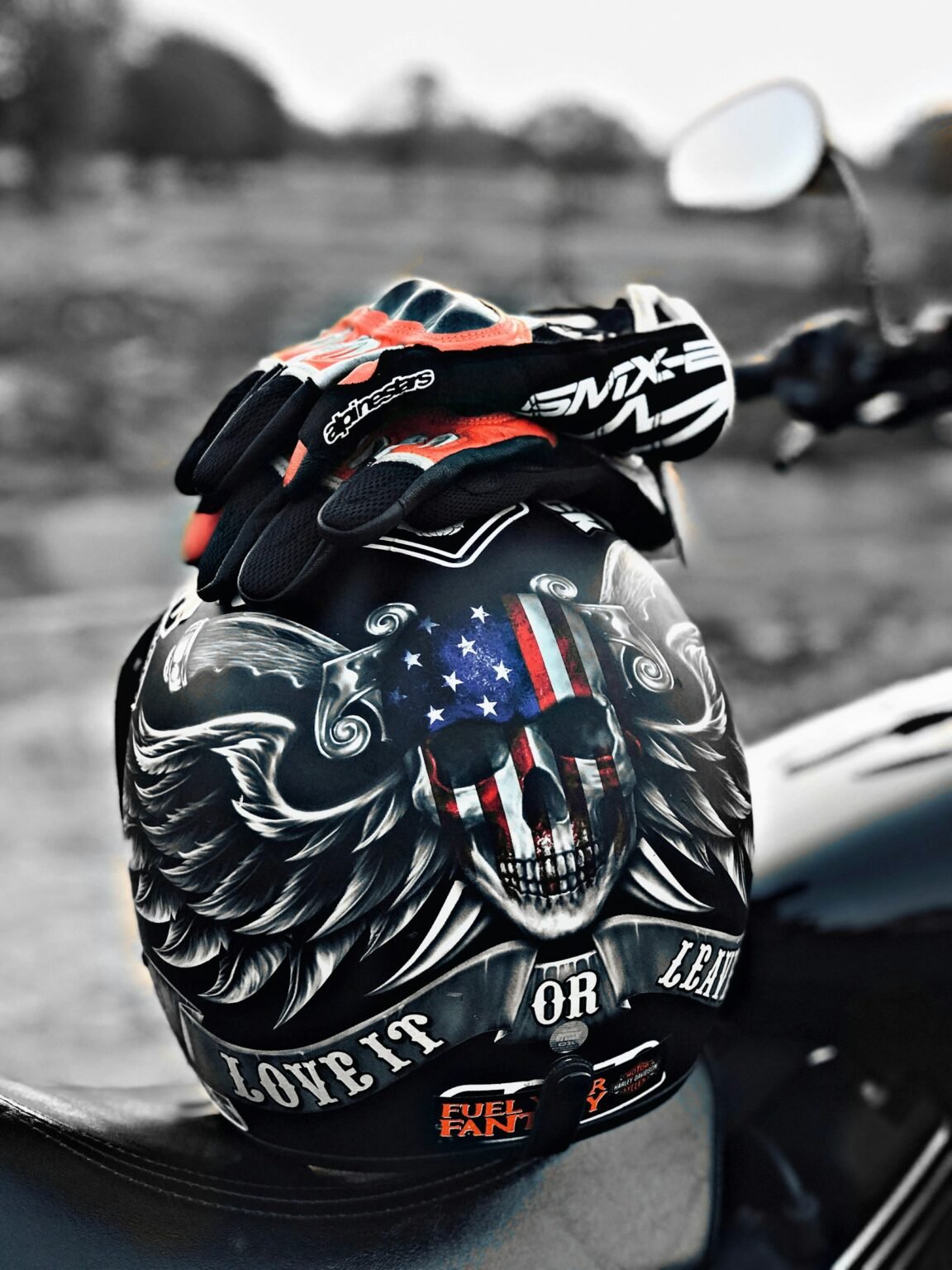 Motorcycle helmet and riding gloves representing rider safety
